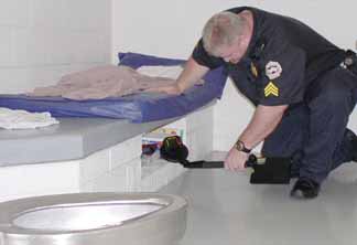 Using a special electronic device to scan for cell phones.